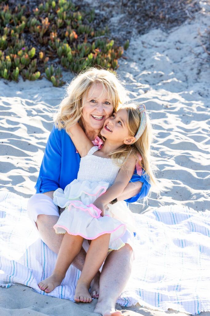 A Windy Evening with a Lifestyle Photographer San Diego Families Trust Heartfelt portrait of family members enjoying a sunny day at Coronado Beach